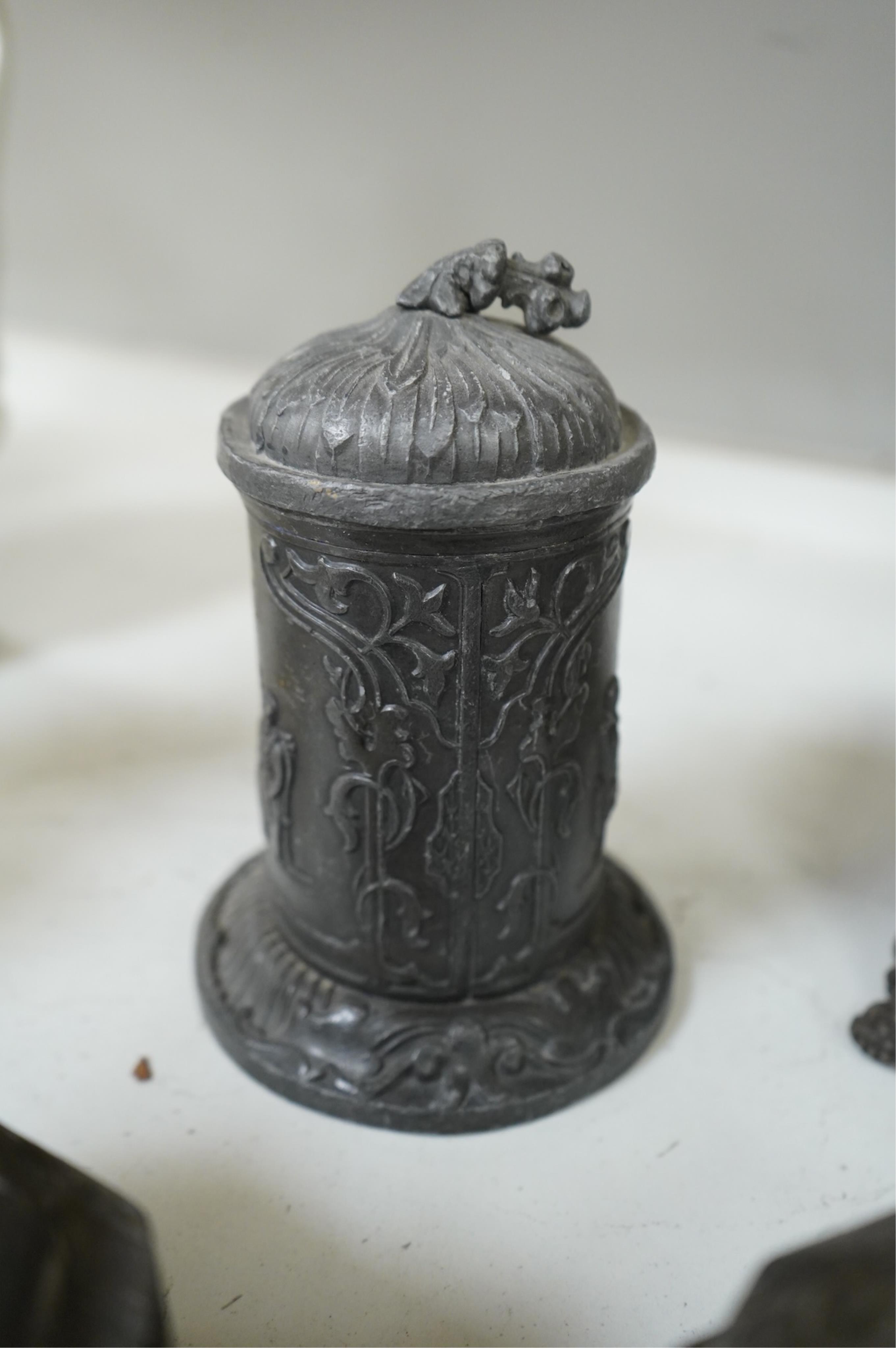 A collection of ten early 19th century lead tobacco boxes to include an octagonal example with remains of paintwork, largest 19cm high